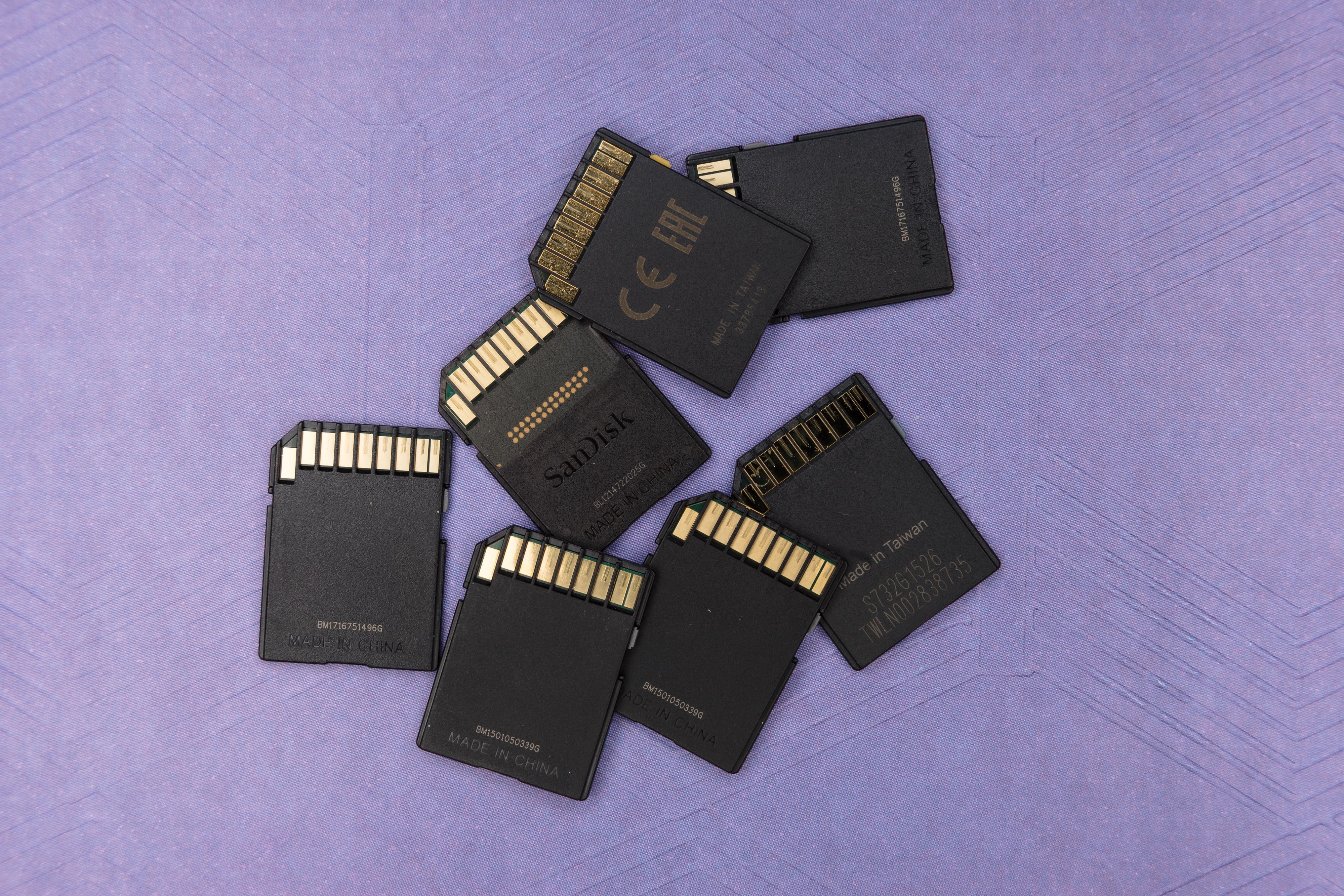 Shows different SD cards scattered on a surface